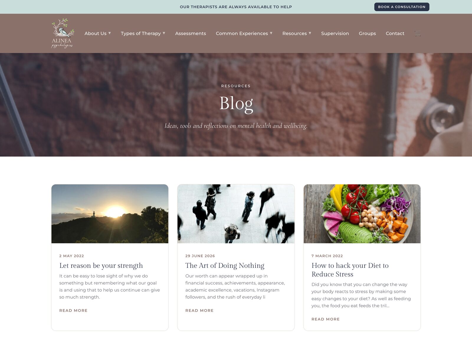The Blog page - three posts with cover images and dates